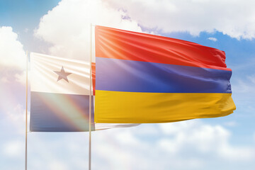 Sunny blue sky and flags of armenia and panama