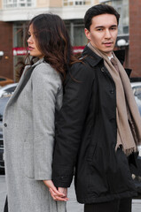 a beautiful young couple walking around the city.man and woman in business style