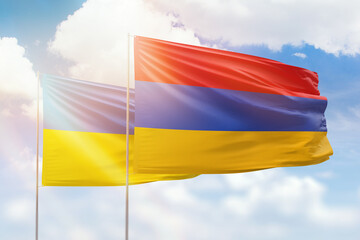 Sunny blue sky and flags of armenia and ukraine