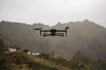 Fototapeta na wymiar Drone flies and taking photos and videos in the mountains.