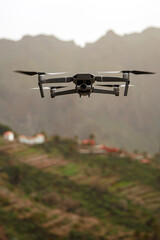 Fototapeta na wymiar Drone flies and taking photos and videos in the mountains.