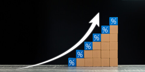 Interest rate financial and mortgage rates concept. Wooden blocks with Icon percentage symbol and...