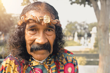 Portrait of an elderly man dressed as Jesus Christ with a leather crown in a cemetery in Managua Nicaragua