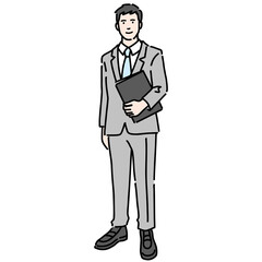 資料を持って笑顔で立っているスーツを着た若い男性