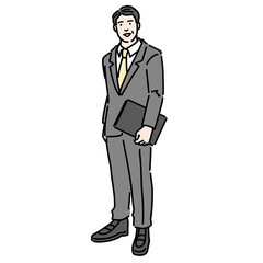 資料を持って笑顔で立っているスーツを着た中年男性