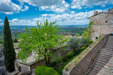 Fototapeta na wymiar Panorama of the ancient houses and countryside surrounding the city of Assisi (Umbria Region, central Italy). Is world famous as birthplace of St. Francis, Italy's christian Patron.