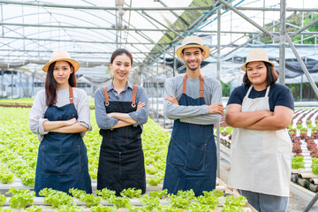 Portrait Group of Asian farmers worker in vegetables hydroponic farm.