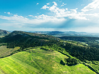 landscape with green field and blue sky