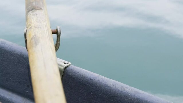 Close-up of rowlock. Close-up of an oar in the process of rowing