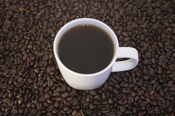 Cup of coffee and coffee beans, caffeine
