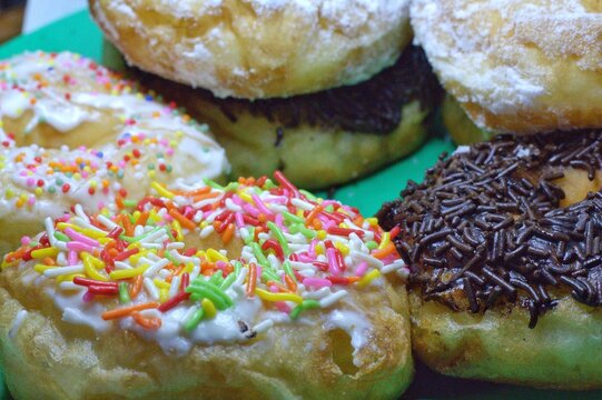 a donut sprinkled with colorful meses
