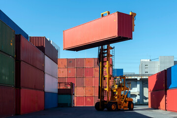 Toplifter " forklift"  for stacking containers in the import / export logistic zone: shipping industry