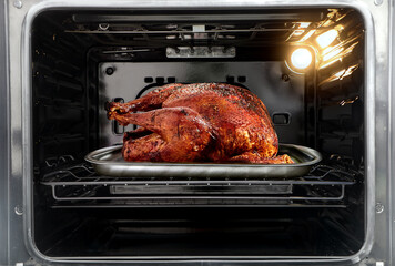 Roast turkey in the oven on Thanksgiving Day