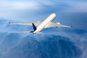 Back view of flying passenger aircraft