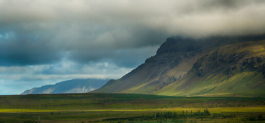 Beautiful landscape of meadow and mountain at morning in Iceland, summertime