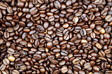 Close-up of roasted brown coffee beans background
