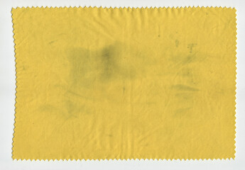 Orange fabric on a white background with scuffs, spots and folds, scan, fine texture is well distinguished.