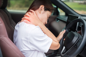 woman with her shoulder and neck sprain while driving car long time, muscle painful. Shoulder ache,...