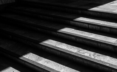 Shade and Sunlight on Vintage Marble Stairs in Monochrome.