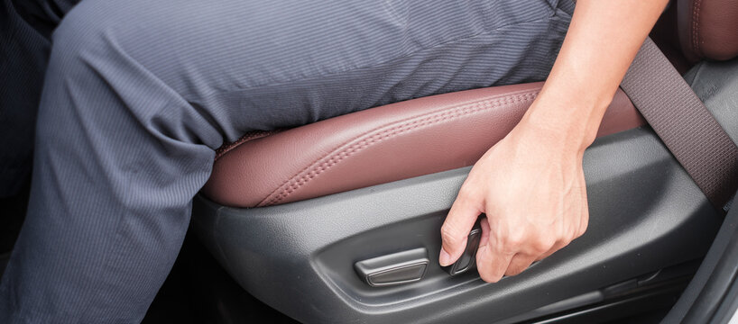 Hand adjust car seat before drive on the road . Ergonomic and safety transportation concept