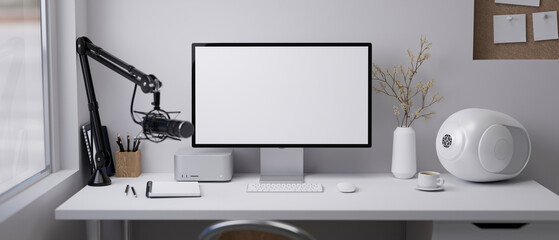 Online influencer modern workspace with computer mockup, microphone, modern speakers