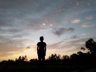silhouette of a person in sunset