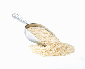 Small metal spoon or scoop with long rice basmati seen isolated on white background.