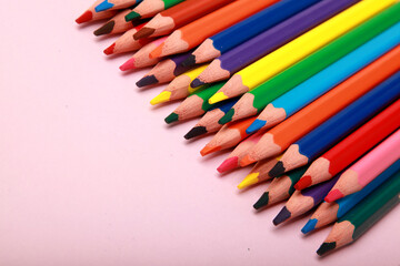 close up photo of a collection of colourful wooden pencil, art supplies. isolated on  studio background with copy space.