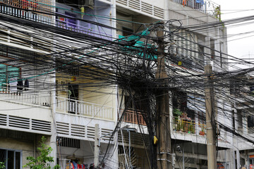 Electric power transmission cables are seen attached to a street pole in Phnom Penh, Cambodia.