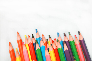 close up photo of a collection of colourful wooden pencil, art supplies. isolated on  studio background with copy space.