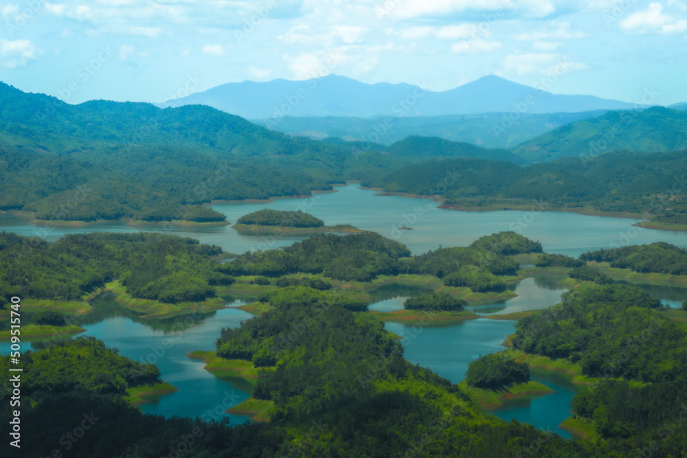 Wall mural Morning at the Ta Dung lake or Dong Nai 3 lake with green hills and mountains. Travel and landscape concept. Travel concept.