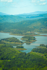 Naklejka na ściany i meble Morning at the Ta Dung lake or Dong Nai 3 lake with green hills and mountains. Travel and landscape concept. Travel concept.