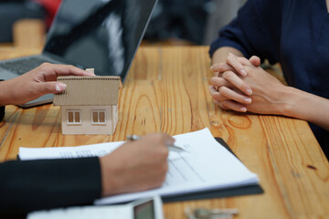 Business woman explain before signing agreement contract for buying house. Bank manager concept.