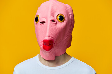 portrait of a man in a funny pink masquerade mask