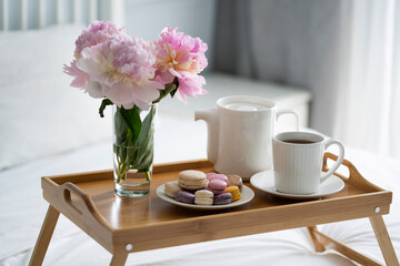 Tray with breakfast on bed.