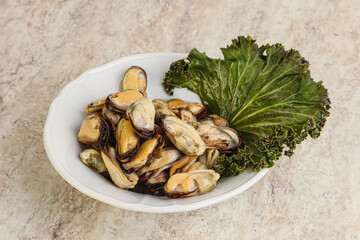 Tasty marinated mussels in the bowl