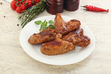 Roasted chicken wings with spicy sauce