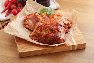 Marinated chicken leg in tomato sauce