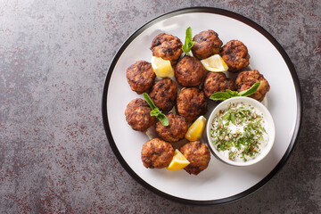 Keftedakia is a Greek traditional dish that is created with minced beef and bread crumbs rolled...