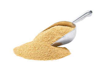 Small metal spoon or scoop with organic amaranth seen isolated on white background.