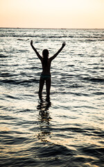 silhouette of a person on the sea