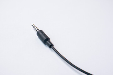 TRRS audio jack with braided cable isolated on white background