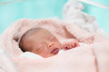 newborn baby face closeup Sleeping in table in hospital