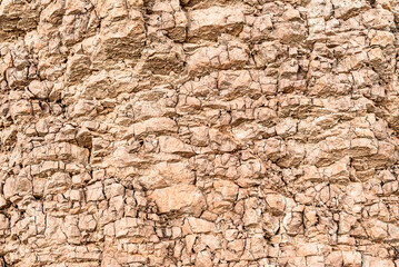 Mountain cracked earth wall background. texture, natural