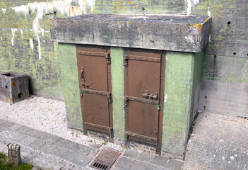 Big massive hermetic metal armored door of WW2 military bunker