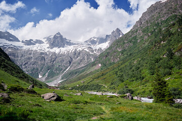 Fototapeta na wymiar Beautiful summer lanscape. Hiking through Alps mountains. Travel by Switzerland.