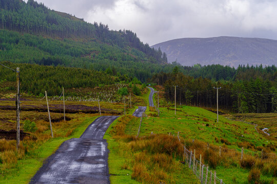 narrow tarmac road leading to Wild Nephim National Park in County Mayo, Ireland