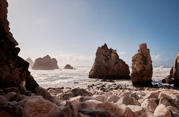 Atlantic ocean beach on the rock coast. Portugal.