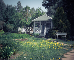 A vintage soviet traditional wooden gazebro in park