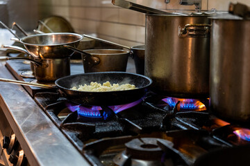 Cooking on stove in commercial kitchen